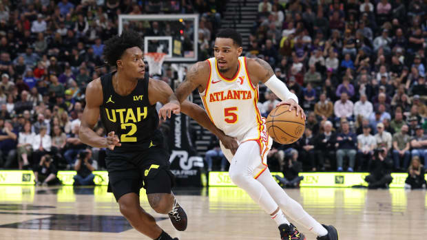 Mar 15, 2024; Salt Lake City, Utah, USA; Atlanta Hawks guard Dejounte Murray (5) drives against Utah Jazz guard Collin Sexton (2) during the second quarter at Delta Center. Mandatory Credit: Rob Gray-USA TODAY Sports